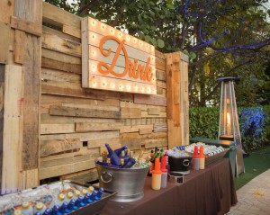 Reclaimed Wood Bar with illuminated Vingtage "Drink" sign on Back Bar